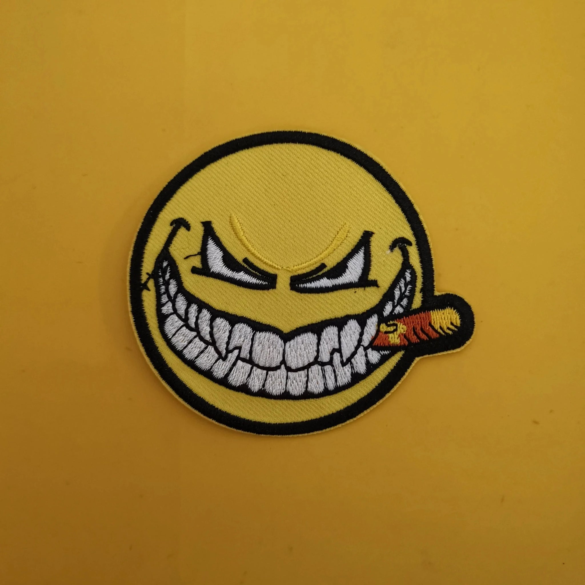 Evil smiley Iron on Patch
